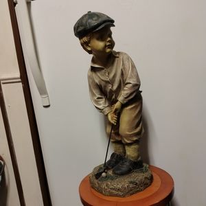Little golfer and a putter return